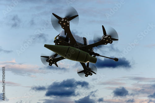 Kamikaze combat FPV drone with a suspended bomb on the background of the evening sky.