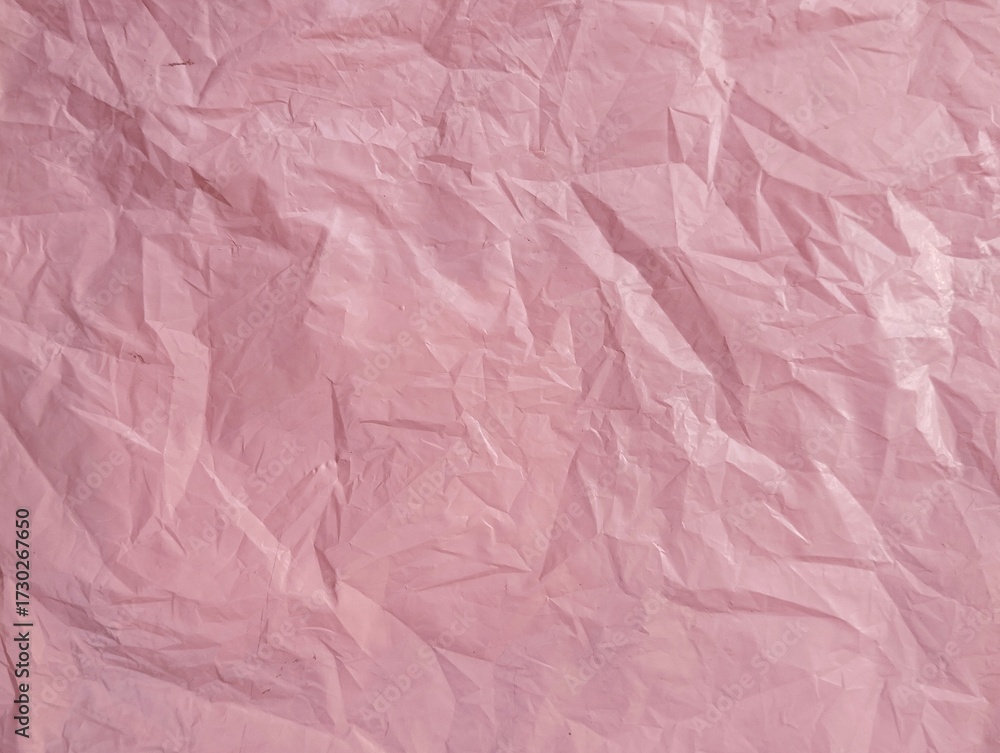 Fototapeta premium Abstract pink crumpled plastic bag texure background