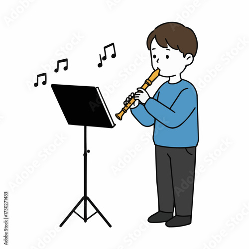 Young boy playing recorder while practicing music at stand  