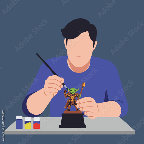 Man paints miniature figurine