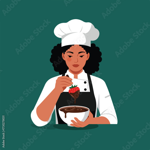 Chef dips strawberry in chocolate