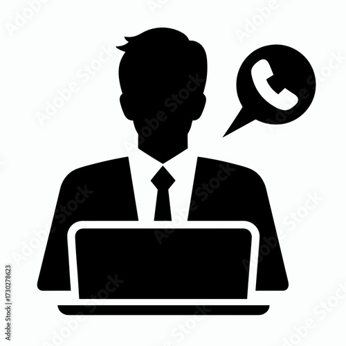 An employee is talking on the phone while working on a laptop