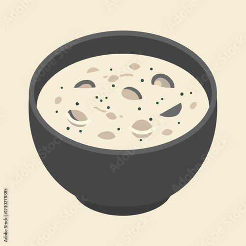 Styled cream soup with toppings in gray bowl on beige background
