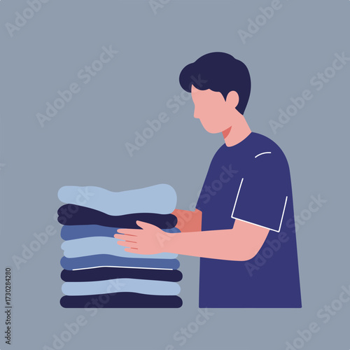 Person folding stack of laundry, side view, blue shirt and background
