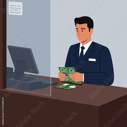 Man in suit counts money at bank counter with computer and glass divider