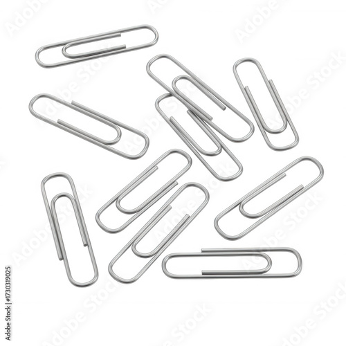 Scattered silver metal paperclips on black background isolated on a transparent background office supplies
