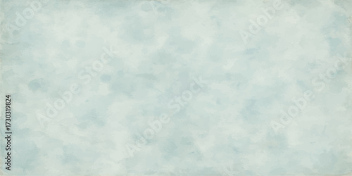 Fluffy white clouds in a bright blue sky with a cool winter feel