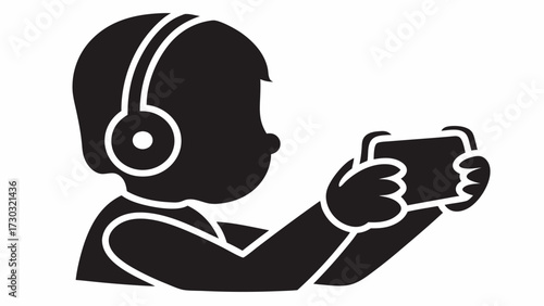 Silhouette of a child wearing headphones and holding a mobile phone in both hands while playing a game