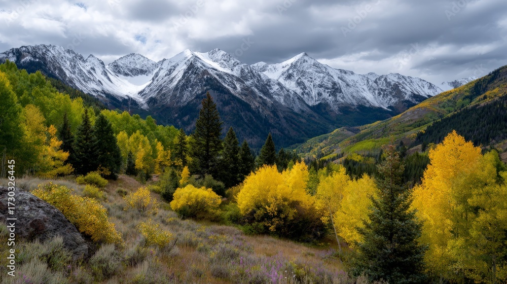 Obraz premium Scenic mountain landscape with autumn foliage and snow-capped peaks