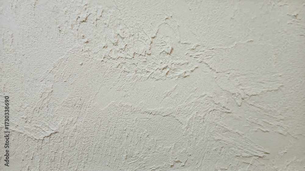 Fototapeta premium Rough beige cement wall texture background with natural light