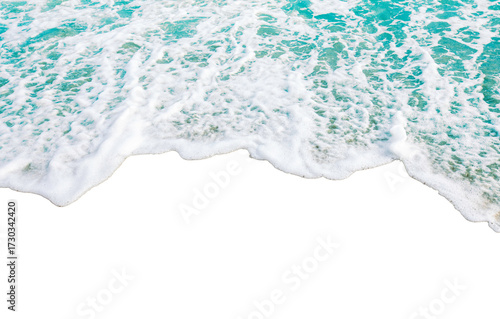 Fototapeta Naklejka Na Ścianę i Meble -  Ocean waves gently crashing on shore with foamy white surf
