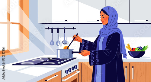 A woman wearing a hijab cooks in a bright, modern kitchen, stirring food in a pot on the stove.