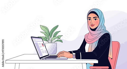 A young Muslim woman wearing a hijab is working on a laptop at a desk with a plant.