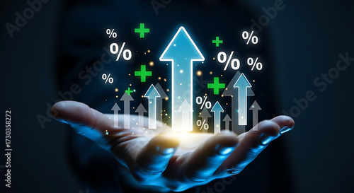 Businessman holding glowing upward arrows with percentage symbols, financial growth, profit increase, business success and economic investment concept