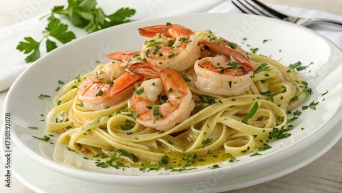 Delicious shrimp scampi with linguine pasta and fresh parsley on white plate