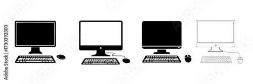 Four computer setups with keyboards and mice desktop