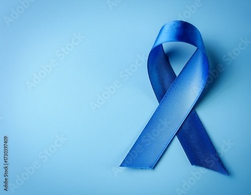 blue ribbon on solid background with copy space movember campaign symbol prostate cancer awareness month
