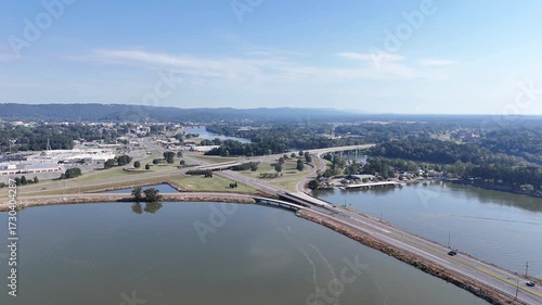Wallpaper Mural Aerial View Of Bridge Over Coosa River, Interstate 759 and Highway 411, Lush Forest, And Distant Hillscape Under Clear Sky. The tranquil water reflects the blue sky, creating a scenic landscape. Torontodigital.ca