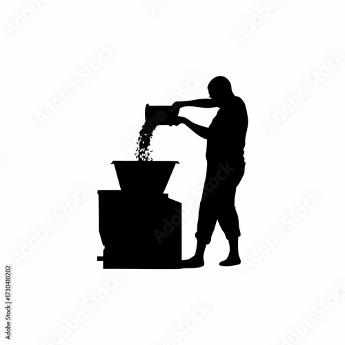 Silhouette of a worker pouring rice into a milling machine isolated on white background