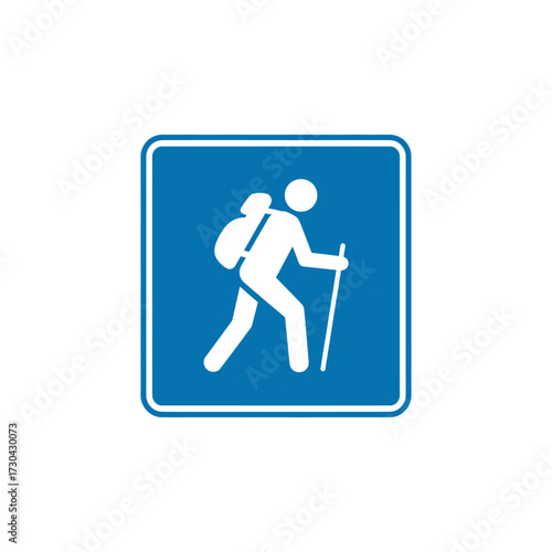 Hiker walking with backpack and trekking pole on blue square sign indicating hiking trail, symbolizing outdoor adventure and recreational activity.