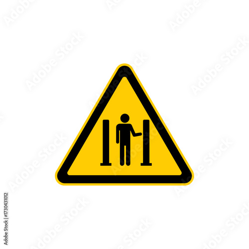 Person passing through metal detector at airport security checkpoint, emphasizing safety and security measures for air travel, creating a sense of caution and awareness.
