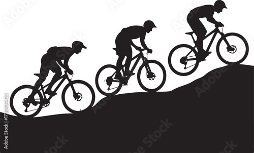 Cyclists race uphill on mountain bikes
