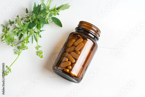 capsules and bottle isolated on white background