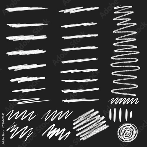 Collection of hand drawn chalk brush strokes and scribbles on a dark background.