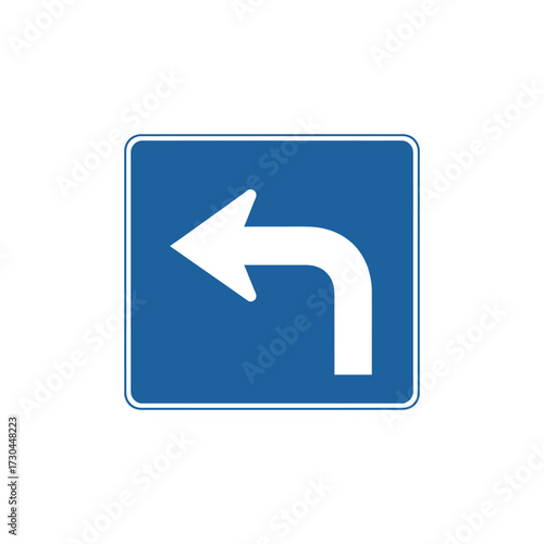 Blue road sign indicates a left turn ahead on a clear day, providing essential guidance for drivers navigating the route ahead, ensuring safe travel.