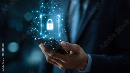 Wallpaper Mural A professional individual holds a smartphone that features a digital padlock icon, symbolizing robust protection and digital security. Torontodigital.ca