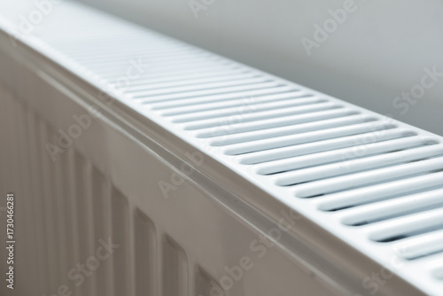 Wallpaper Mural A white heat radiator is installed beneath a window. The fall of the cold weather and the rise in consumer prices.  Torontodigital.ca