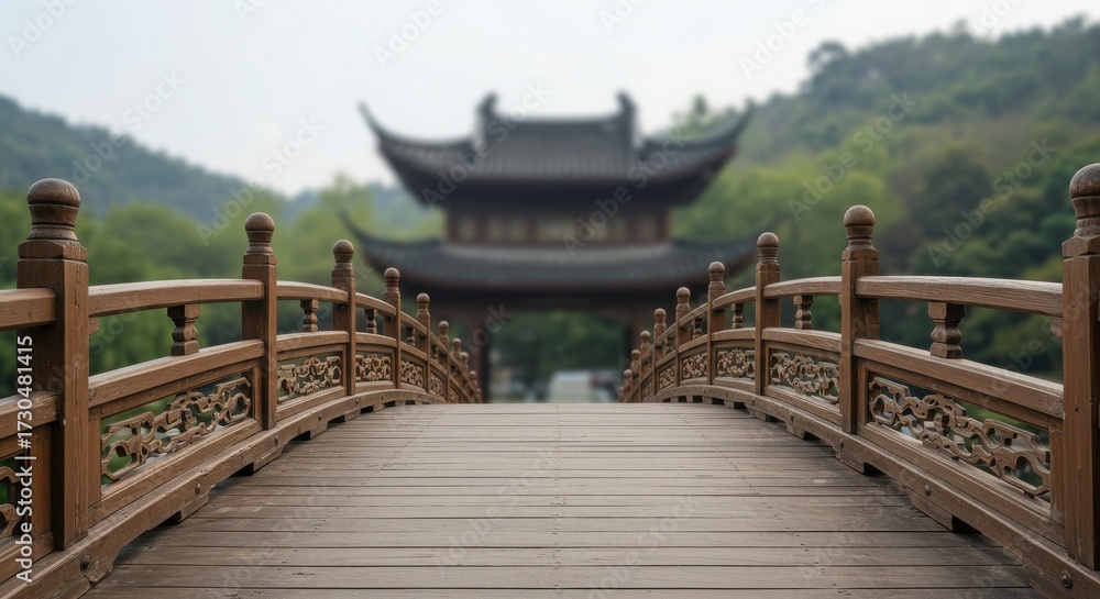 Obraz premium Entry shot of a Chinese curved wooden bridge with intricate railing designs