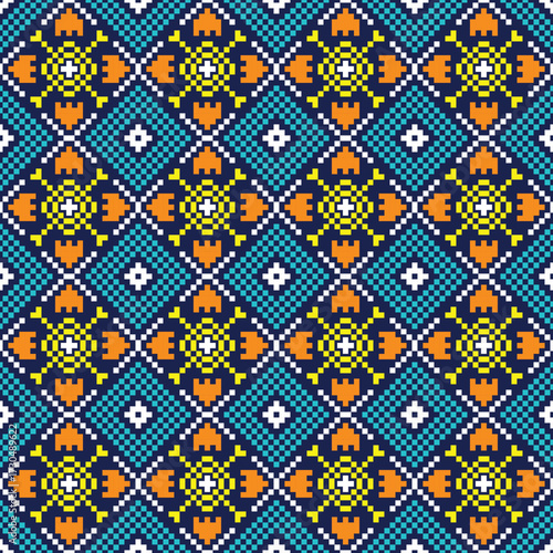 Pixel art textile pattern in blue, yellow, orange, and white, arranged in repeating diamond shapes with floral motifs.