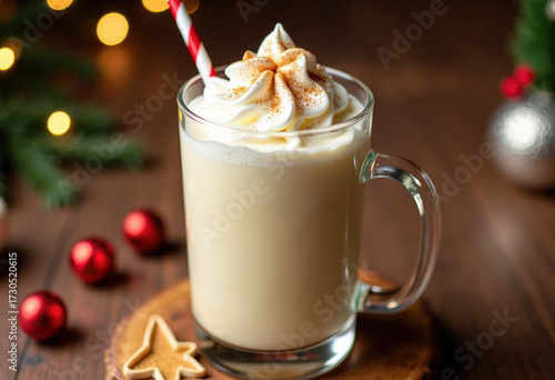 Festive Christmas eggnog cocktail served in glass with whipped topping and spices, perfect for winter holiday celebrations. Christmas eggnog cocktail with whipped cream and sprinkle of nutmeg.