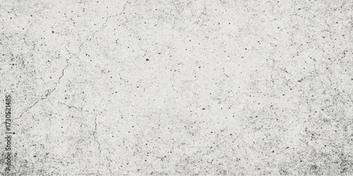 Roughly textured concrete wall surface with a layer of old, dirty paper creating a grunge blank backdrop