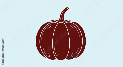 A dark red pumpkin with a light blue background.