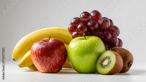Fototapeta Naklejka Na Ścianę i Meble -  Fresh assorted fruits apple banana kiwi grapes