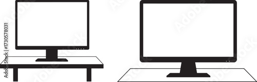 Two computer monitors on stands silhouette