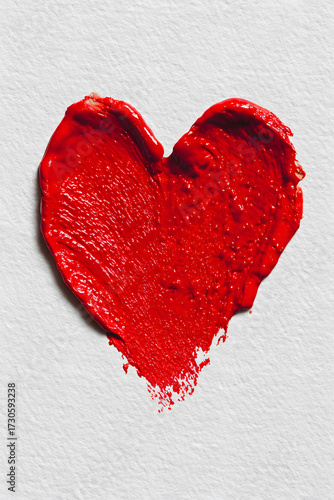 Intense Red Paint Heart Shape Brush Stroke with Visible Texture on Rough White Paper Background