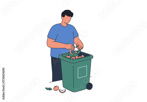 A person disposing food waste into a green bin some waste lays beside the bin