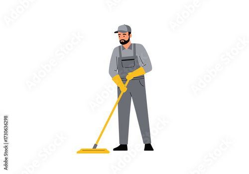 Worker in grey overalls and cap mops the floor with a yellow mop He wears yellow gloves