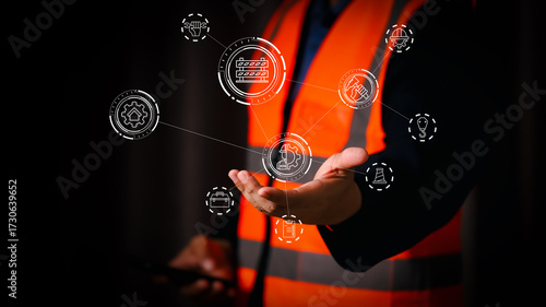 Worker in safety vest presenting digital contract management and factory industry icons, symbolizing teamwork, business agreement, automation, and smart industrial technology solutions.