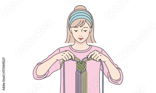 Creative young woman skillfully crafting intricate macrame knotwork with vibrant colorful cords for unique handmade accessories