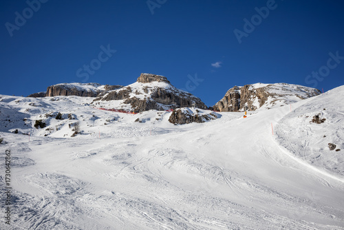Wallpaper Mural Snowy Ski Slope in the Dolomites, Italy. Freshly Groomed Piste with Winter Landscape and Rock in the Background. Torontodigital.ca