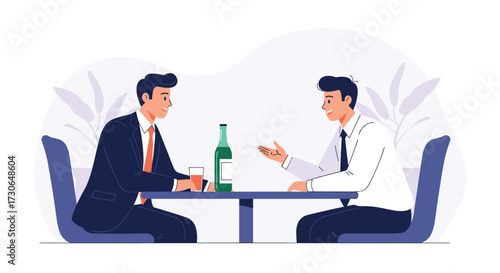 Two businessmen discussing plans over drinks in a restaurant.