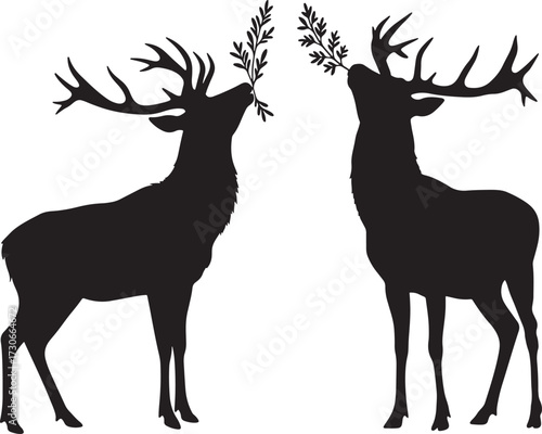 Two majestic deer silhouettes reaching for foliage silhouette