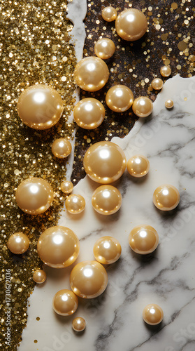 Golden pearls scattered on marble and glitter textured background