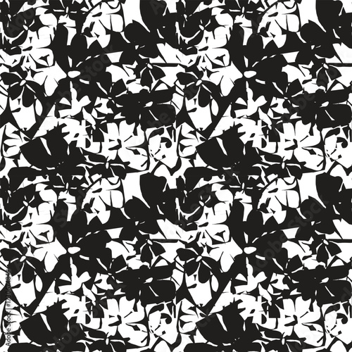 A black and white repeating floral pattern of abstract  silhouette print on a white background, creating a striking and bold visual effect.

