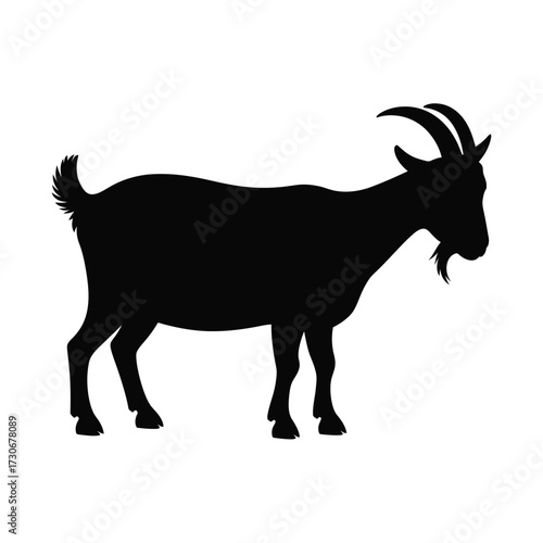 Silhouette of a standing goat with horns and beard