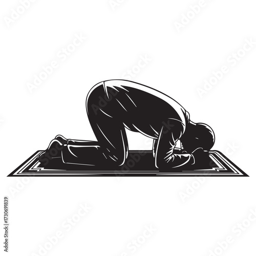 Silhouette of a muslim man praying on a prayer mat in the prostration position during islamic worship and devotion